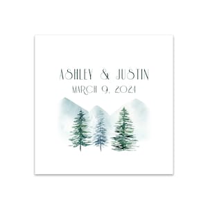 May include: A watercolor illustration of a mountain range with three evergreen trees in front of it. The text "Ashley & Justin March 9, 2024" is above the mountains.