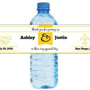 May include: A white wedding favor water bottle label with yellow accents. The label says "thank you for joining us Ashley & Justin on this very special day July 29, 2018 San Diego, Ca".