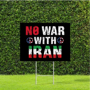 May include: A black yard sign with the words "NO WAR WITH IRAN" in red and white block letters. The word "WITH" has a peace symbol with the American flag design on each side. The word "IRAN" is in the colors of the Iranian flag.