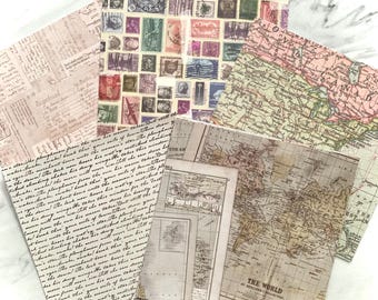 May include: A collection of decorative paper sheets with vintage designs. The sheets feature various patterns, including antique stamps, old maps, and handwritten text in shades of beige, pink, and brown. The paper is arranged in a layered composition.