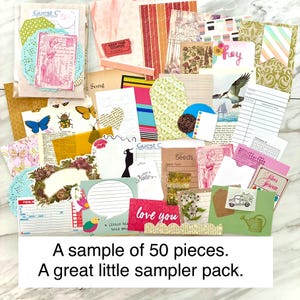 May include: A collection of ephemera, including tags, cards, and paper scraps, in various colors and patterns. The assortment includes floral designs, butterflies, and the text "love you". The text "A sample of 50 pieces. A great little sampler pack." is also visible.