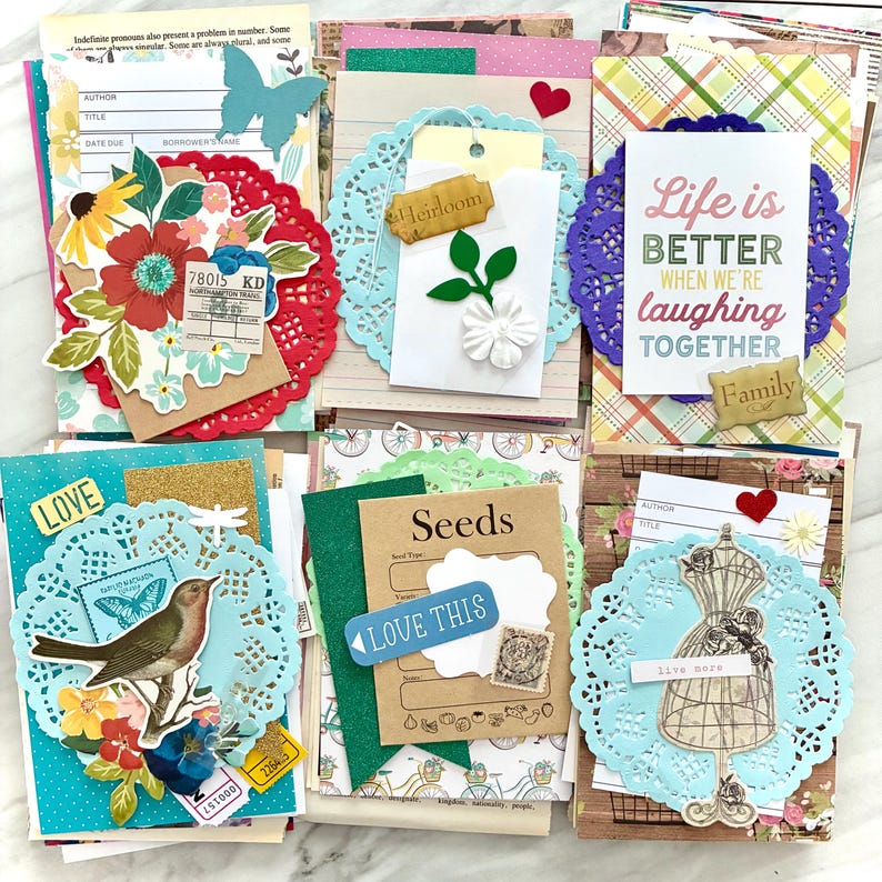 Junk Journal Ephemera Kit. A large assortment of paper pieces in different colors and themes. Great to add new, interesting pieces to your projects without purchasing a variety of items.  Available in packs of 50, 100, and 200 pieces. Includes scrapbook papers, reproduction vintage pieces, real vintage pieces, die cuts, accents, office papers, tickets, tags, game pieces, words, journal cards, and so much more!