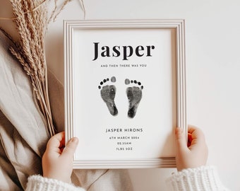 May include: A white framed print with black text that reads "Jasper and then there was you".  The print also includes a pair of black baby footprints and the text "Jasper Hirons, 6th March 2024, 02:35am, 7lbs 5oz".