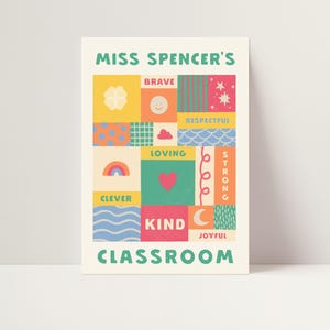 May include: A rectangular poster titled MISS SPENCER'S CLASSROOM featuring a grid of colorful squares and rectangles. The design includes icons like a rainbow, heart, and moon, with words such as BRAVE, RESPECTFUL, LOVING, STRONG, CLEVER, KIND, and JOYFUL.