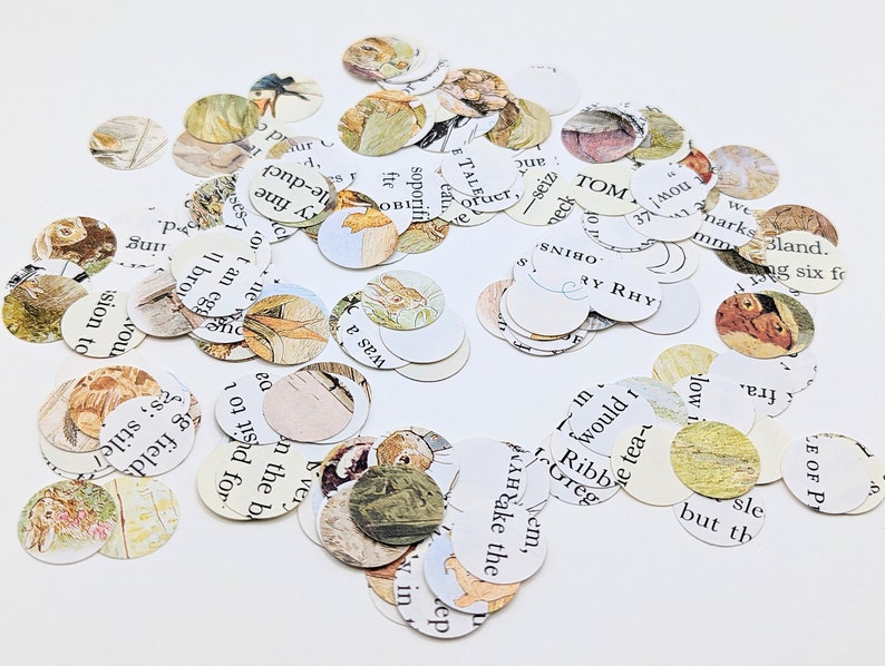 May include: A collection of small, circular paper cutouts featuring illustrations and text from a children's book. The cutouts have a vintage aesthetic with soft colors and images of rabbits and other animals.