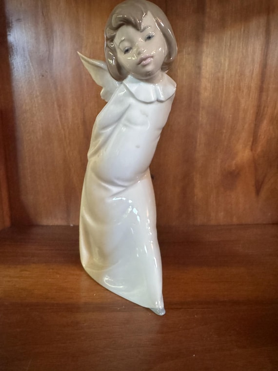 Lladro #4960 “Curious Angel” Figurine