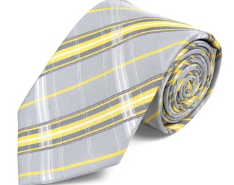 May include: A gray and yellow plaid tie. The tie is rolled up and ready to be worn.