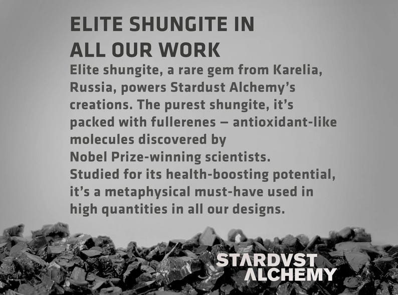 May include: Black and white image of a pile of dark gray rocks with the text "ELITE SHUNGITE IN ALL OUR WORK" and "STARDVST ALCHEMY" at the bottom. The text describes the use of shungite, a rare gem from Karelia, Russia, in the company's products.