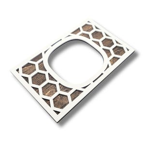 May include: A rectangular decorative wooden frame with a white border and a honeycomb pattern. The center features a rounded square opening, and the wood has a natural brown finish. The frame is angled, casting a slight shadow.