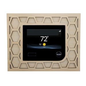 May include: A wood-framed thermostat with a black digital display showing the temperature 72 degrees Fahrenheit. The thermostat has a honeycomb pattern around the display and a Carrier logo.