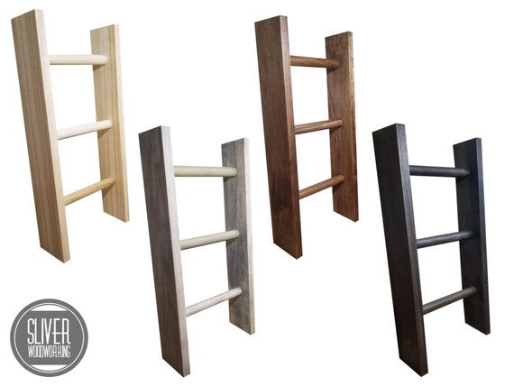 Wall outlet towel ladder