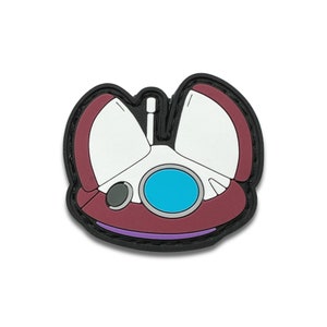 May include: A black, white, and burgundy colored patch with a cartoon spaceship design. The spaceship has a blue window and a small antenna.