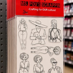May include: A clear plastic package containing a sheet of black and white line art stickers featuring various figures. The red header card displays the text 'AiMten Presents: MS. POU'S SCRAPPIN -Crafting for OUR culture!' with icons of a glue gun and scissors.