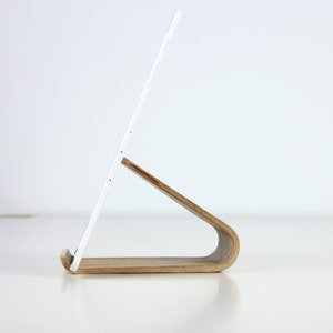 Minimalist wooden iPad stand holding a tablet, perfect for hands-free use in the kitchen, office, or home