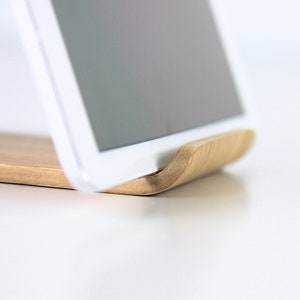 Minimalist wooden iPad stand holding a tablet, perfect for hands-free use in the kitchen, office, or home