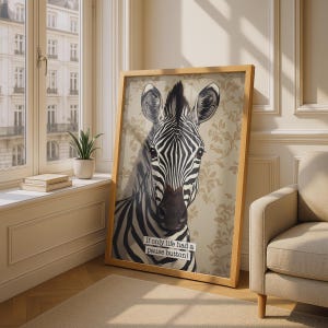 May include: A framed vertical wall art print featuring a black and white zebra portrait against a beige floral patterned background. The zebra is centred, and a white rectangular label at the bottom contains the text: If only life had a pause button!