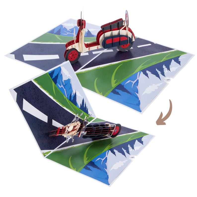 Puede incluir: Una tarjeta emergente roja y blanca con un scooter vintage conduciendo por un camino sinuoso con colinas verdes y monta&ntilde;as azules en el fondo.