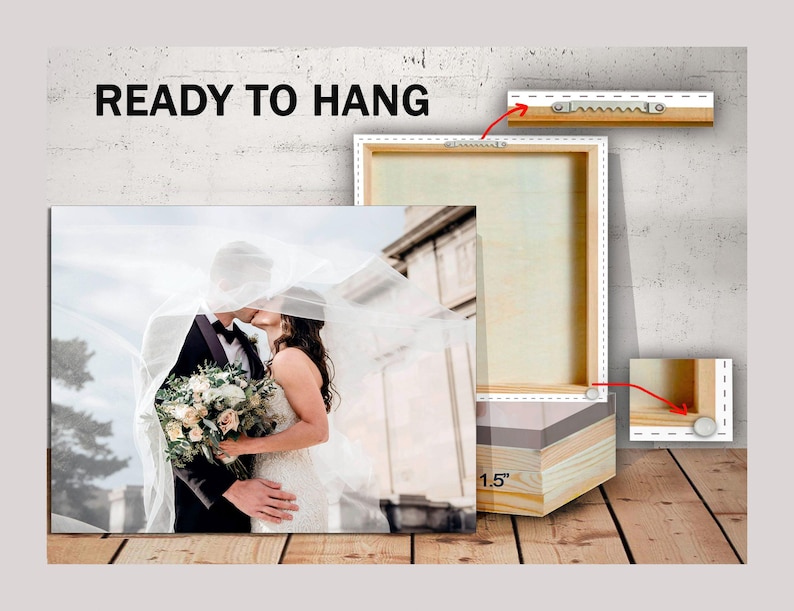 May include: A canvas print of a wedding couple kissing under a white veil. The print is ready to hang and has a 1.5 inch wood frame.