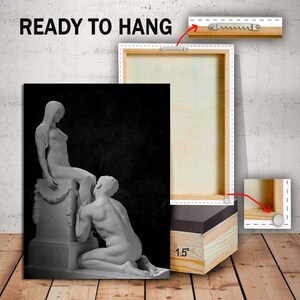 May include: Black and white canvas print of a sculpture of two figures. The sculpture is of a woman sitting on a pedestal and a man kneeling in front of her. The print is ready to hang and comes with a 3.8 cm deep frame.