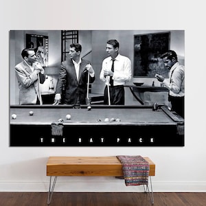 May include: Black and white photo of four men playing pool. The men are wearing suits and ties. The photo is titled "The Rat Pack".