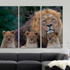 May include: A large male lion with a thick mane is surrounded by three cubs. The lion is looking directly at the camera, while the cubs are looking up at the lion. The image is a split-screen, with the lion in the center and the cubs on either side.