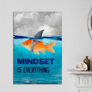 May include: A motivational poster with a gold fish wearing a shark fin and the text "Mindset is Everything" in blue letters. The fish is swimming in blue water with a cloudy sky in the background.