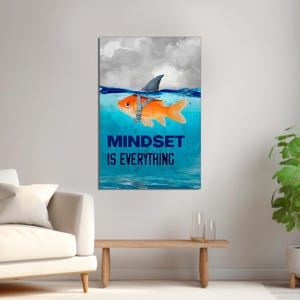 May include: A motivational poster with a goldfish wearing a shark fin and the text "Mindset is Everything". The goldfish is swimming in blue water with white clouds in the background.