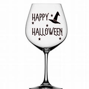 May include: A clear glass wine glass with a black vinyl decal that says "Happy Halloween" with a witch's hat and stars.