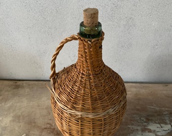 Old glass and wicker bottle