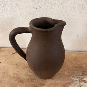 Beautiful vintage pitcher in earth