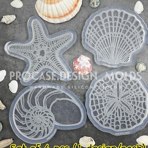 May include: Set of four clear silicone molds for crafting. The molds are shaped like a starfish, seashell, nautilus shell, and sand dollar. The text "PROCASE.DESIGN_MOLDS" and "HANDMADE SILICONE MOLDS" is visible on the molds. The text "Set of 4 pcs (1 design/each)" is visible at the bottom of the image.