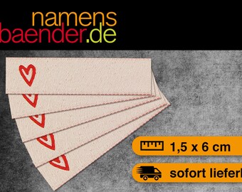 May include: Five beige fabric labels with red heart designs. Each label measures 1.5 inches by 6 inches.