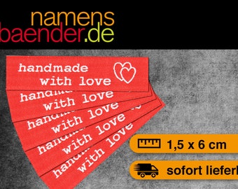 May include: Five red fabric labels with white text that reads "handmade with love" and a white heart design. The labels are stacked on top of each other. The labels measure 1.5 inches by 6 inches.