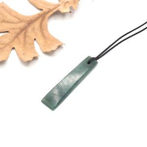 Hand Carved Guatemalan Light Blue jadeite Jade Celt Pendant