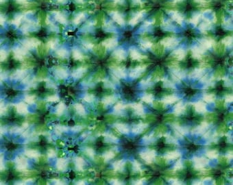 May include: A seamless pattern of blue, green, and white tie-dye. The pattern is made up of repeating circles with a starburst effect.