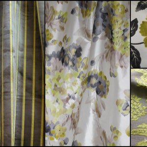 May include: Four fabric swatches in different patterns and colors. The first swatch is a brown and yellow striped fabric. The second swatch is a white fabric with a floral pattern in shades of gray, yellow, and pink. The third swatch is a white fabric with a large green floral pattern. The fourth swatch is a gray fabric with a green floral pattern.