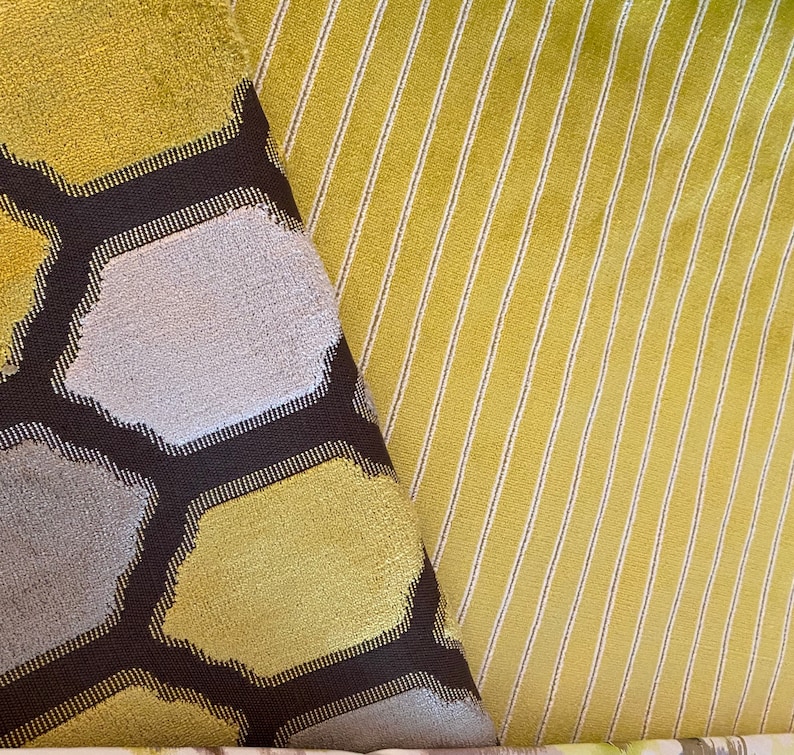 May include: Two fabric swatches, one with a honeycomb pattern in shades of yellow and gray, and the other with a striped pattern in yellow and white.