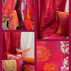 May include: A collage of vibrant home decor items in shades of red, pink, and orange. The image features patterned curtains, throw pillows, and a chair cushion. Floral and leaf patterns are prominent, with gold and silver accents. The textiles create a luxurious and colorful interior design theme.