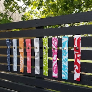 Luggage strap. Luggage tag. Snap on fabric strap for luggage and bags.  Make finding your luggage easier at the airport.
