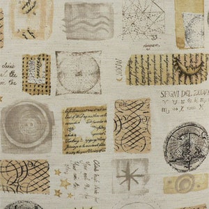 May include: A beige fabric with a repeating pattern of various shapes and designs. The shapes include circles, squares, and stars. The designs include handwritten text, astrological symbols, and geometric patterns. The fabric has a vintage aesthetic.