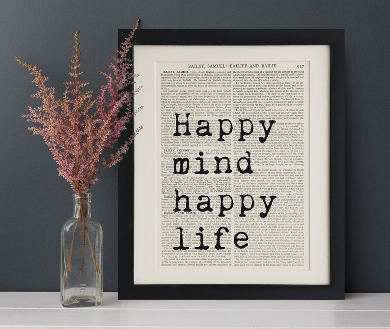 Puede incluir: Una impresi&oacute;n enmarcada en negro con fondo blanco y texto negro que dice "Happy mind happy life".