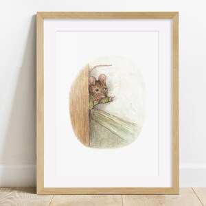 May include: A framed art print showing a watercolour illustration of a mouse looking out from behind a wooden door. The mouse wears a green jacket and a pink bow tie. The artwork has a soft, whimsical style, with a light colour palette.