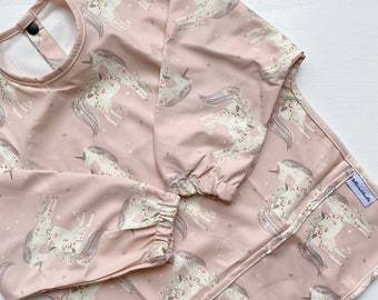 Pink unicorn print Long Sleeved Baby Bib | Coverall Wipe clean Bib with unicorns | magical unicorn Print Toddler Bib