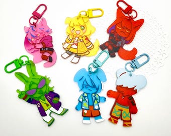 May include: Six acrylic character keychains with colourful metal clasps. The designs feature stylised figures in pink, yellow, red, green, blue, and white with orange accents, each showcasing unique outfits and expressions in a flat, graphic art style.