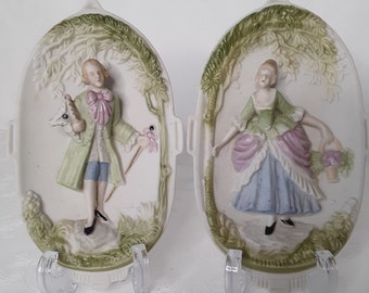 Vintage Chase bisque oval wall decor.   Two Victorian style, made in Occupied Japan which would have been 1945 to 1952.   Hand painted.