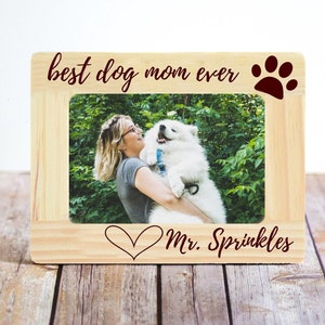 May include: Wooden photo frame with the text "best dog mom ever" and a red paw print. The frame also has a heart and the text "Mr. Sprinkles".