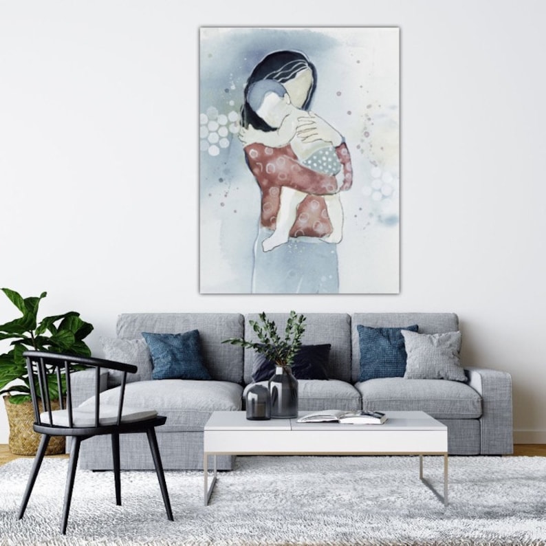 May include: A watercolor painting of a mother holding a baby in her arms. The painting is done in shades of blue, gray, and red. The mother is wearing a red shirt with white polka dots and the baby is wearing a blue shirt with white polka dots.