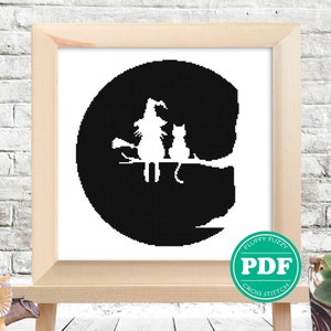 May include: Black and white cross stitch pattern of a witch and a cat sitting on a branch in front of a full moon. The pattern is in a circular frame and has the text "PDF" in a green circle.