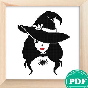 May include: Black and white cross stitch pattern of a witch with a pointed hat and a spider on her necklace. The pattern is framed and ready to be stitched.