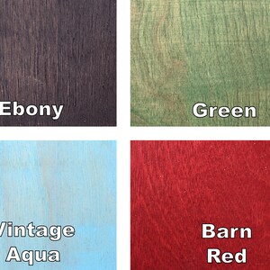 May include: Four wood samples with different colors and textures. The colors are Ebony, Green, Vintage Aqua, and Barn Red. Each sample has the color name in white text.